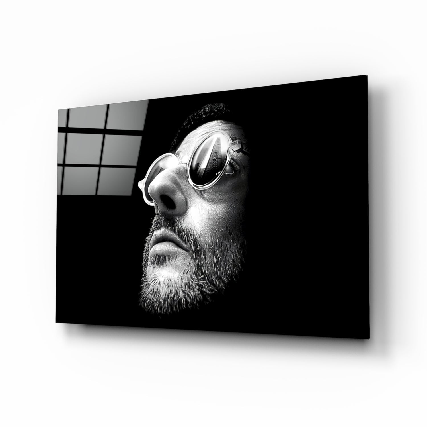Black and white portrait of bearded man wearing round sunglasses displayed on glass wall art panel.