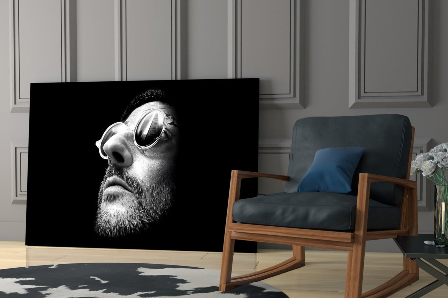 Black and white portrait glass wall art of bearded man in profile wearing round sunglasses, displayed in modern living room.
