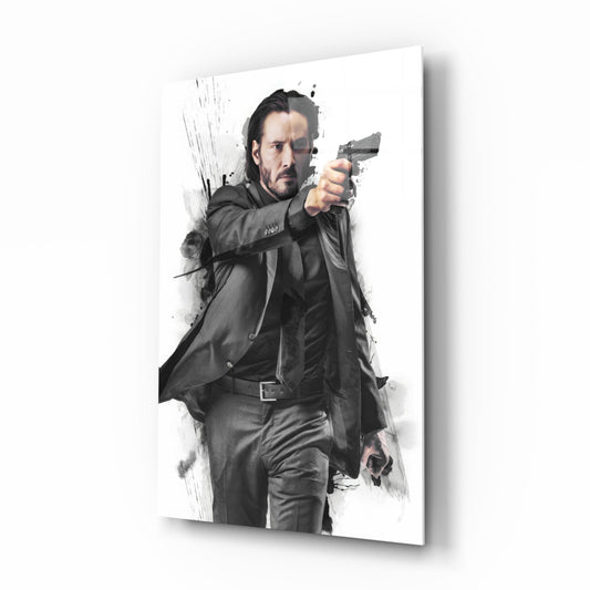 Man in dark suit and long coat aiming handgun forward against white background with gray ink splash effects on glass.