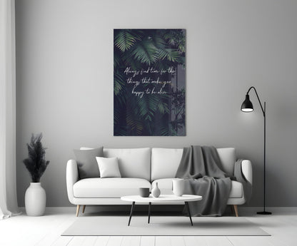 Modern living room with white sofa displaying motivational glass wall art featuring green foliage and white text above coffee table.