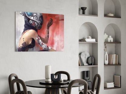 Transmutation glass wall art depicting a tattooed figure with mechanical elements against red background, displayed above round black dining table in modern interior.
