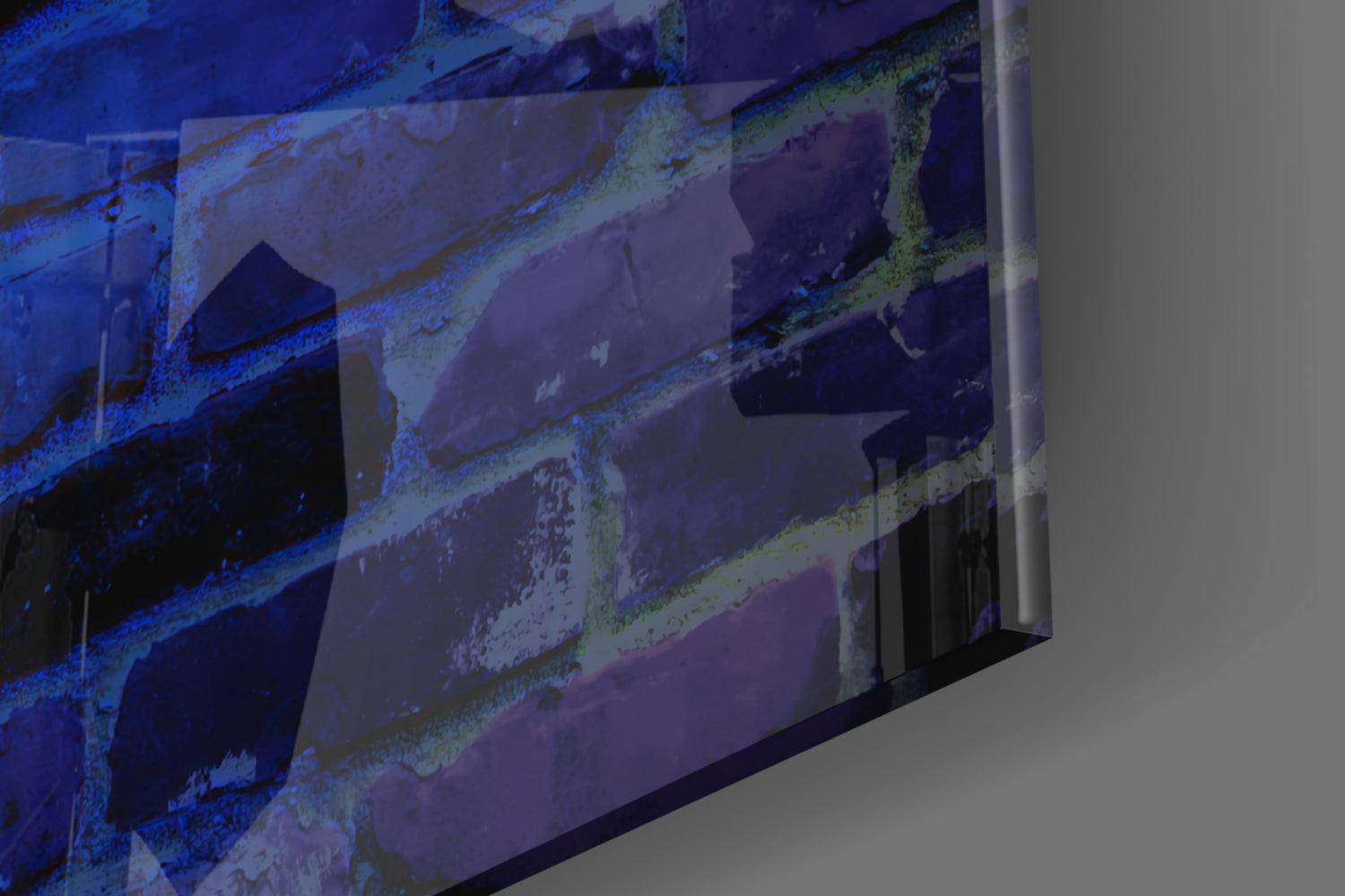 Close-up angled view of glass wall art displaying blue-lit metal structural elements with green patina and corrosion details.