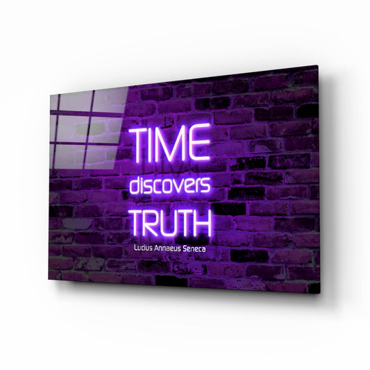 Angled view of glass wall art displaying purple neon text "TIME discovers TRUTH" with Seneca quote on brick background.