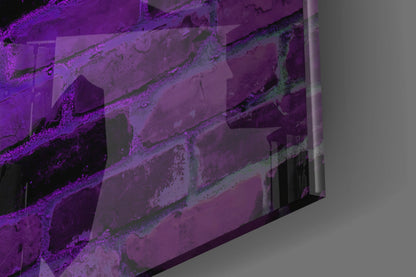 Angled close-up view of purple-lit glass wall art showing textured surface with moss-green accents and architectural relief details.