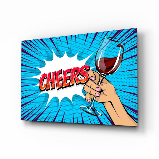 A canvas pop art print showing a hand holding a wine glass with red wine against a blue starburst background and "CHEERS" text in red.