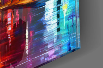 Angled perspective of illuminated glass wall art displaying vibrant red, blue, and cyan neon lights over architectural building imagery.