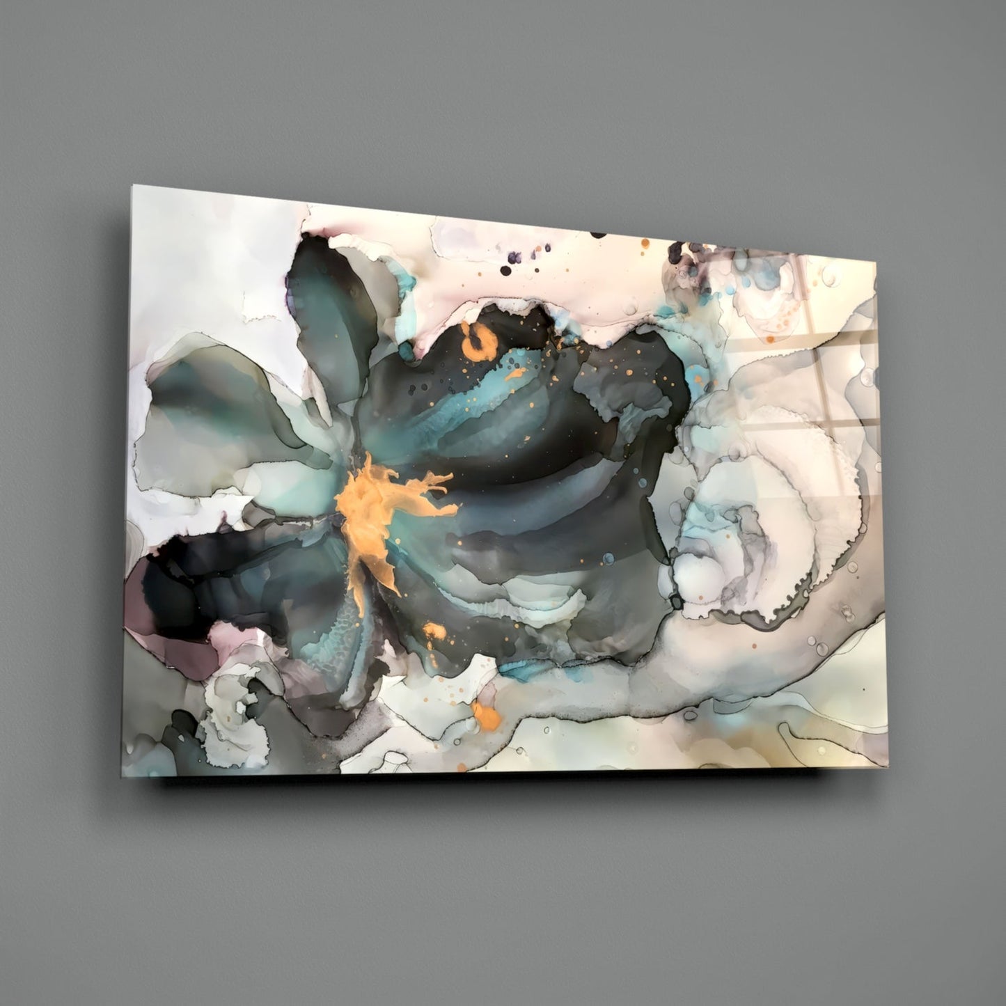 Abstract marble flower glass wall art featuring swirling teal, black, orange, and cream tones displayed at an angle against gray background.