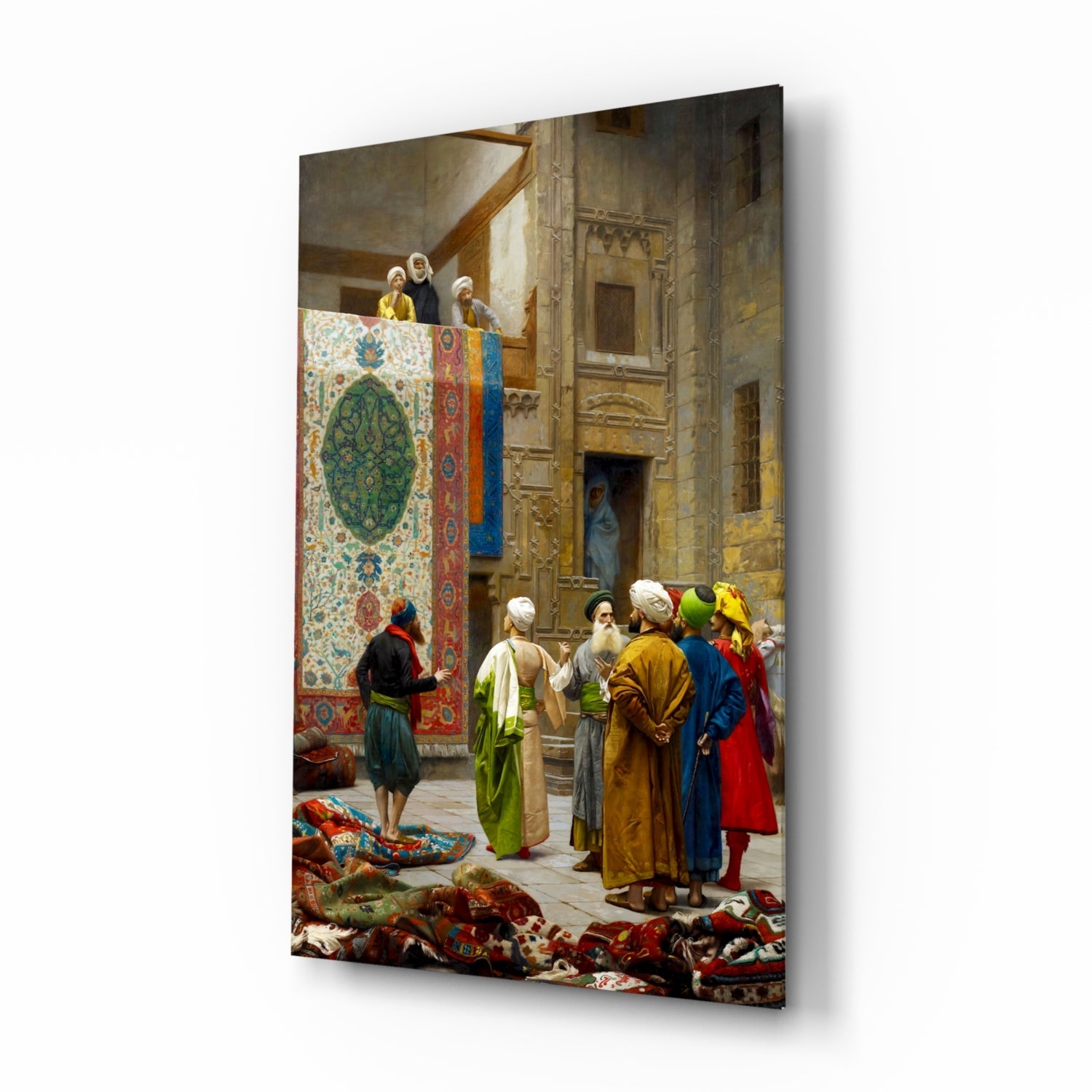 Glass wall art displaying an Orientalist painting of merchants and customers examining colorful carpets in an ornate Middle Eastern interior courtyard.