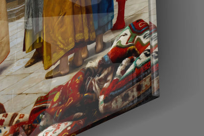 Glass wall art displaying an angled view of a classical painting featuring figures in ornate red and gold robes on a light wooden floor background.