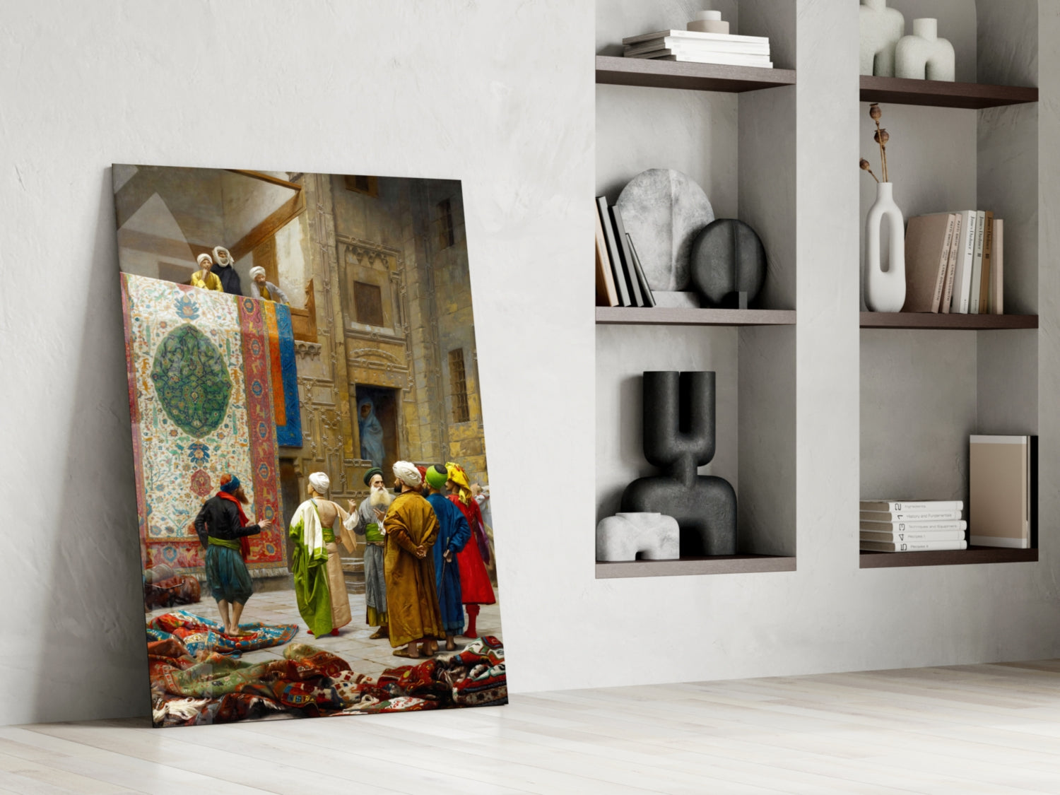 Glass wall art leaning against white wall displaying colorful orientalist painting of figures in robes with carpet and architectural interior.