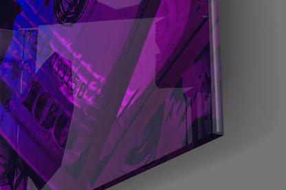 Close-up angled view of purple and blue neon-lit glass wall art with dark text silhouettes against translucent panels.
