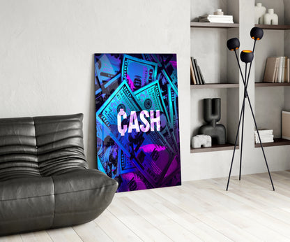 Neon "CASH" glass wall art with cyan and magenta dollar bill design displayed in modern living room next to black leather sofa.