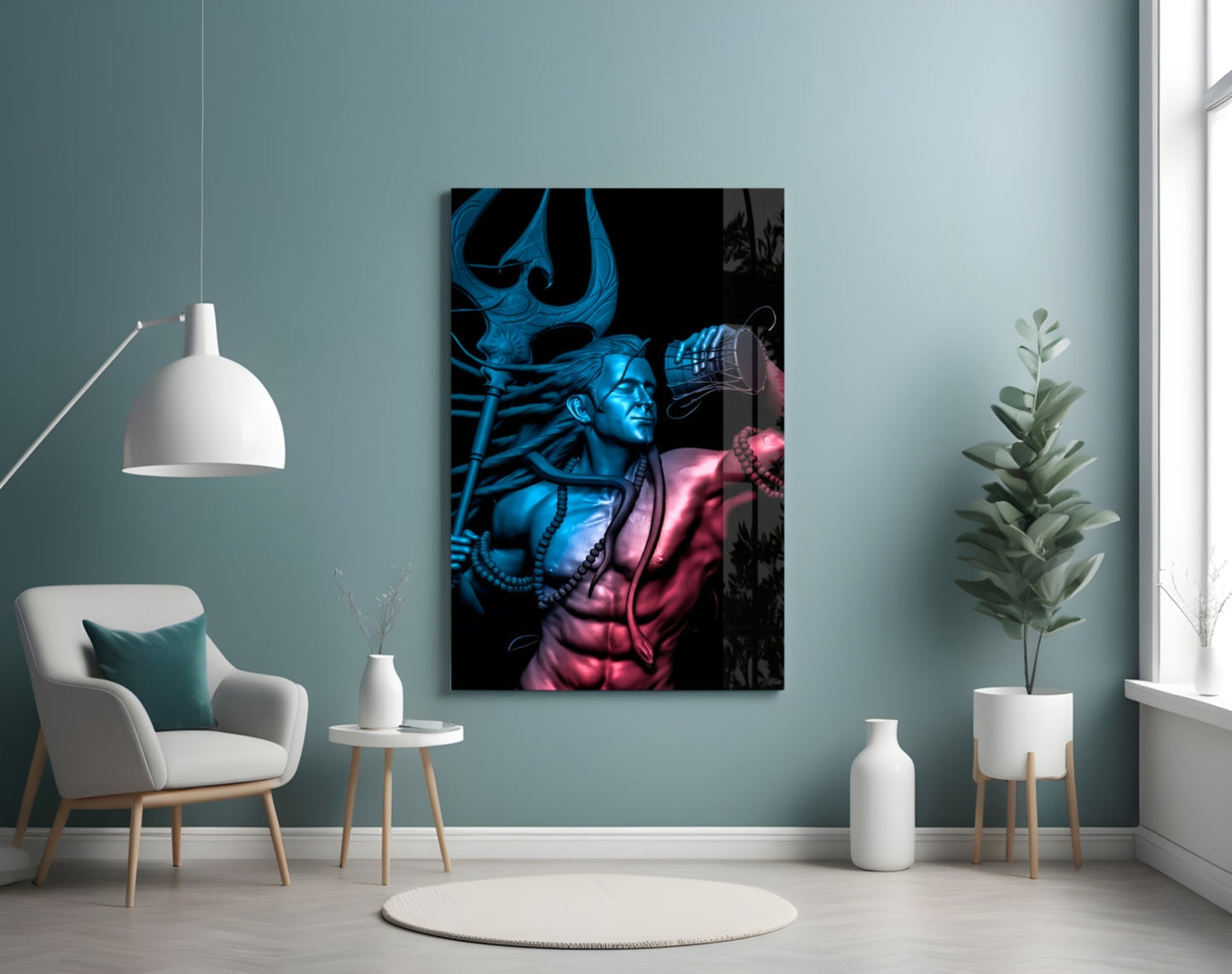 Har Har Mahadev glass wall art displayed on pale blue wall above white chair, showing blue and pink illuminated deity figure with ornate headdress.
