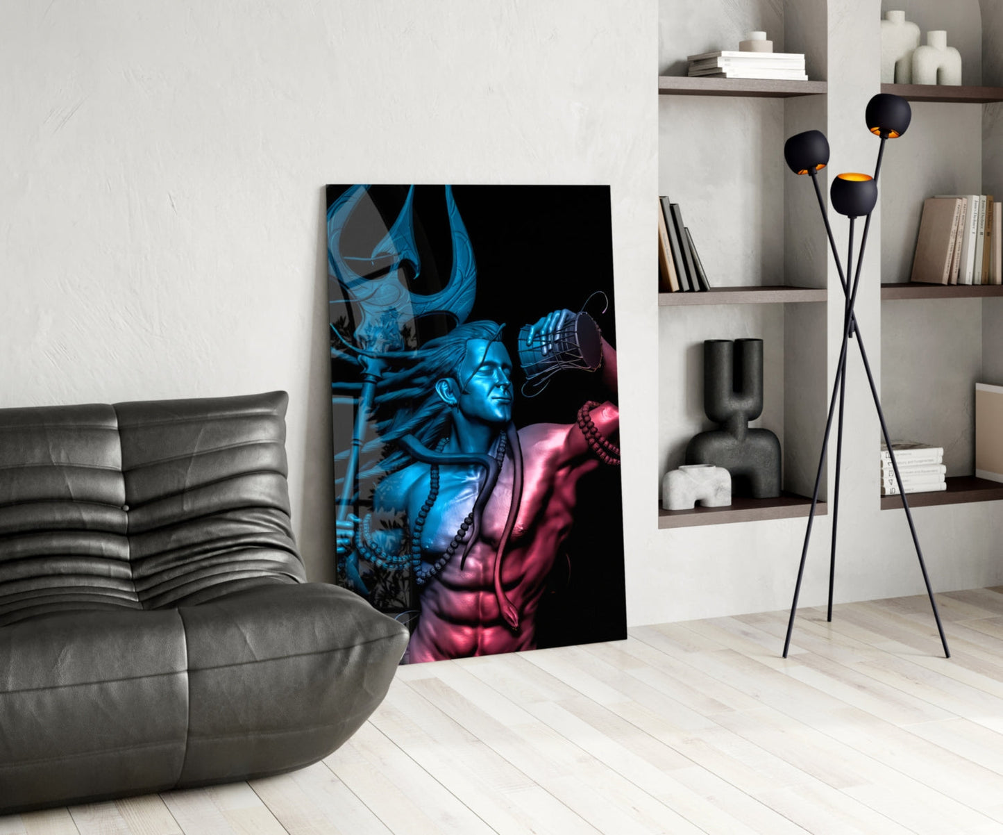 Modern living room interior with blue and pink neon-lit glass wall art depicting deity figure displayed against white wall beside grey sofa.