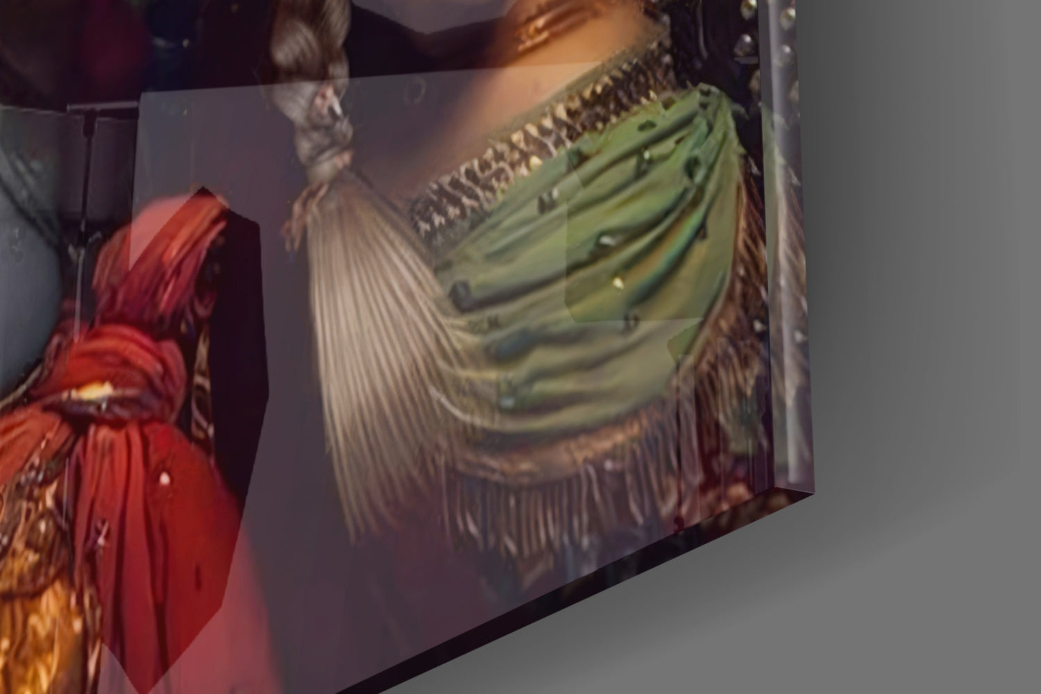 Close-up of glass wall art showing red draped fabric on left and green pleated garment detail on right panel.