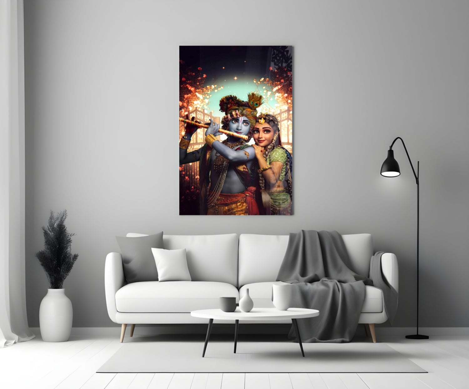 Krishna and Radha glass wall art hanging above white sofa in modern living room interior.