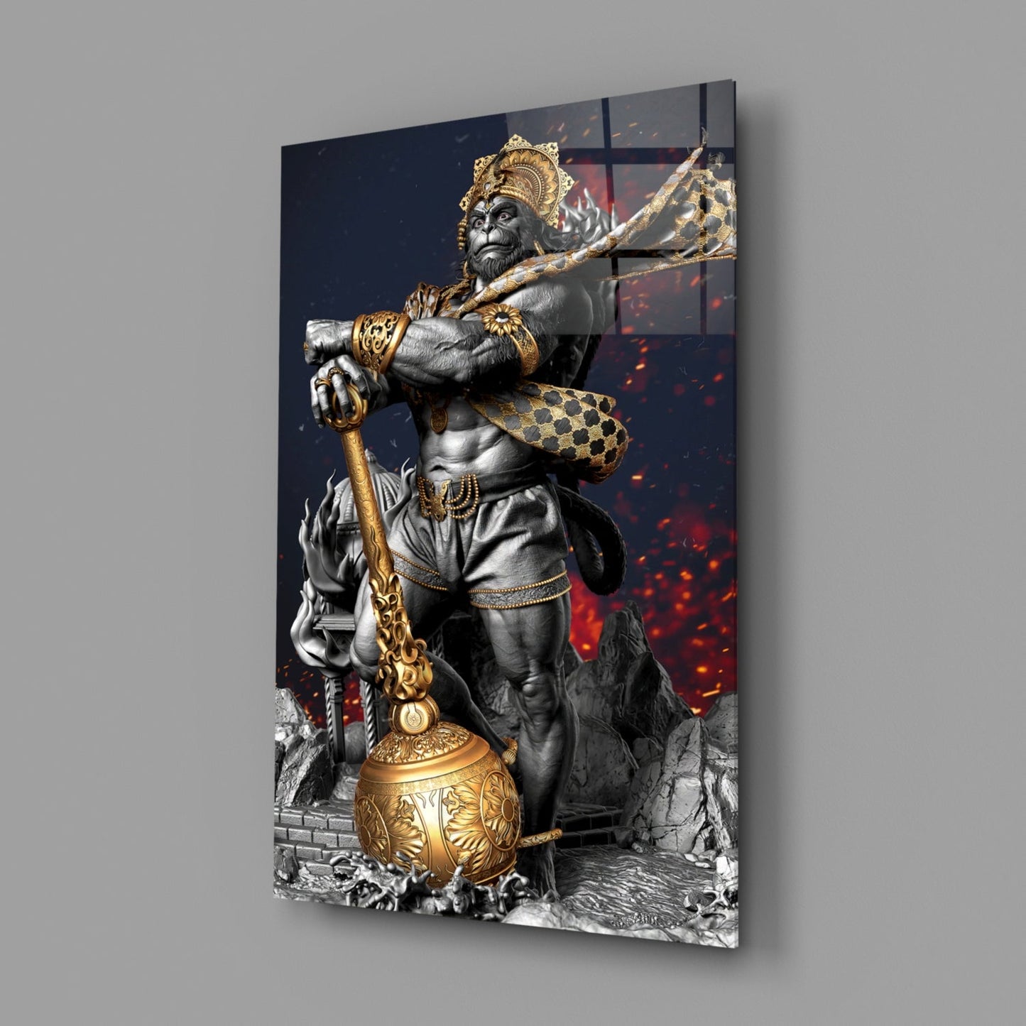 Ape King Glass Wall Art displayed at an angle showing a regal monkey statue in grayscale with gold accents, holding a staff against a dark background with red fiery elements.
