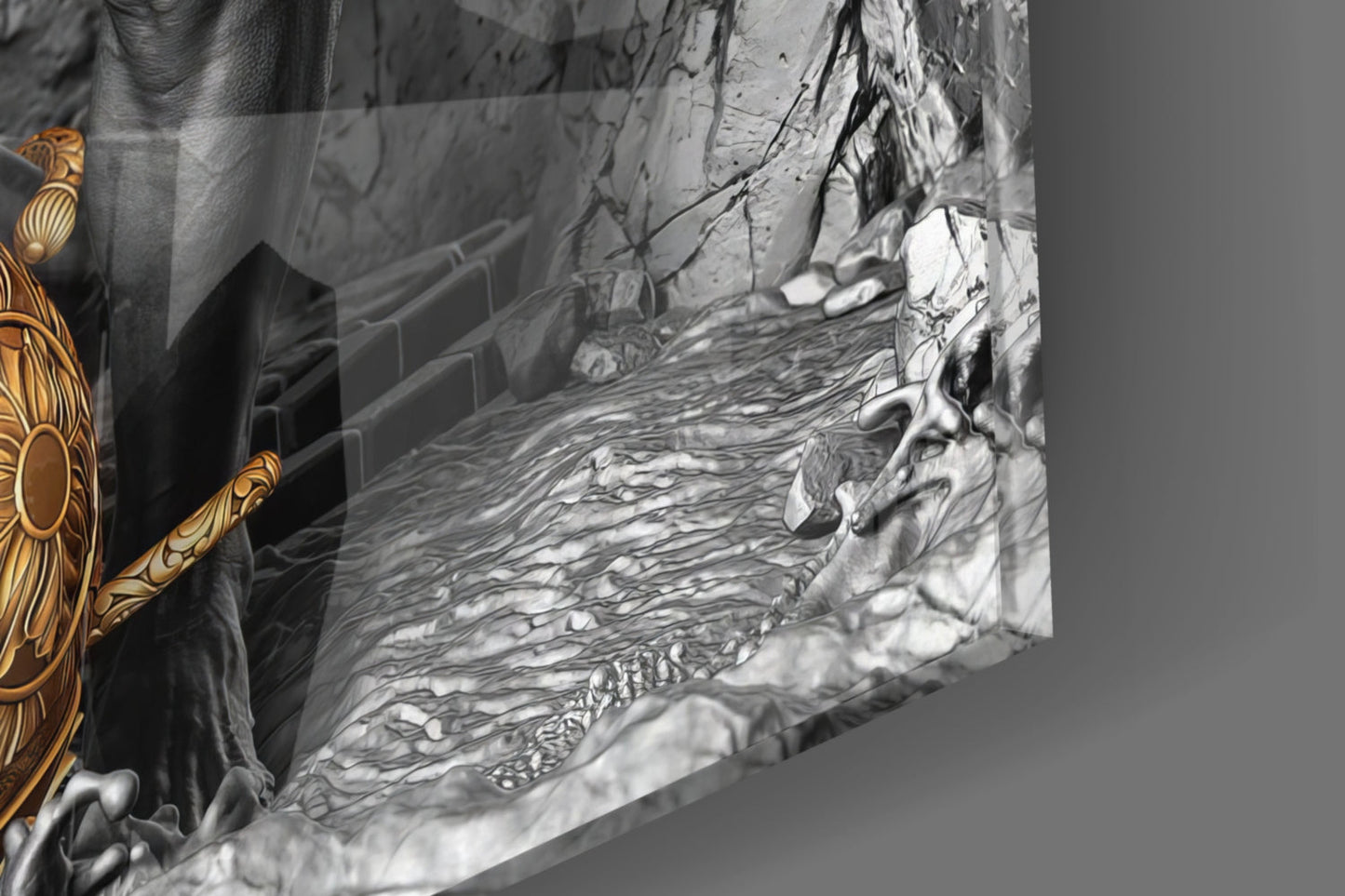 Close-up angled view of textured glass relief sculpture showing flowing water detail with gold decorative element visible on left edge.
