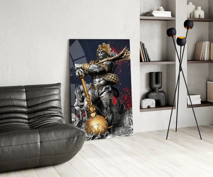 Modern living room displaying Ape King glass wall art featuring gold and silver warrior statue against dark background with red accents.