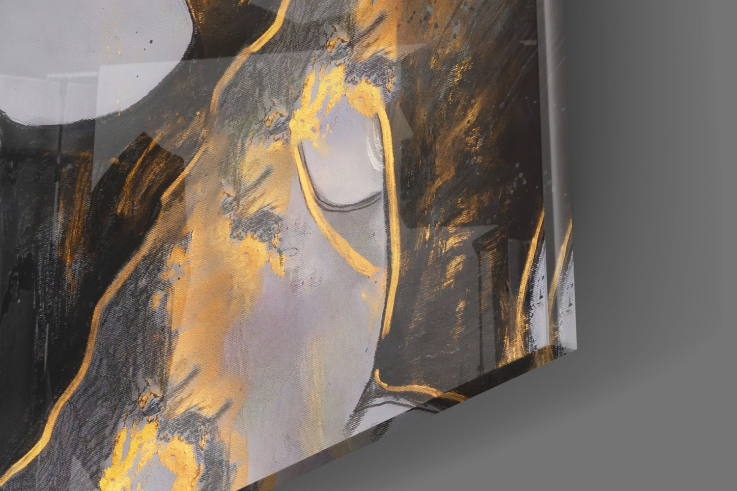 Close-up angle of Gipsy Beauty Glass Wall Art showing gold and charcoal abstract design with white space on curved glass panel.
