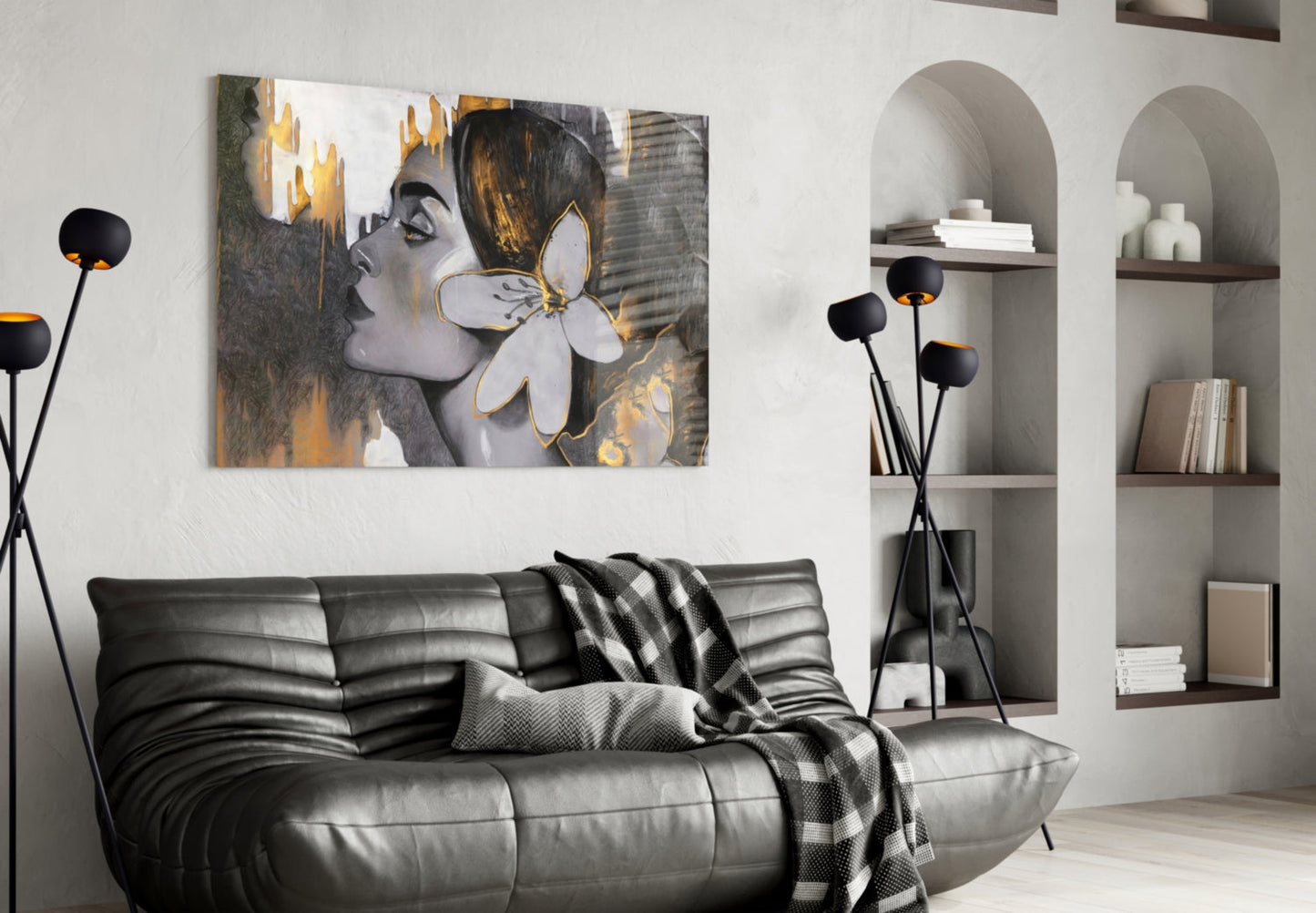 Modern living room with black leather sofa displaying Gipsy Beauty glass wall art featuring a woman's profile with white and gold flower above shelving.
