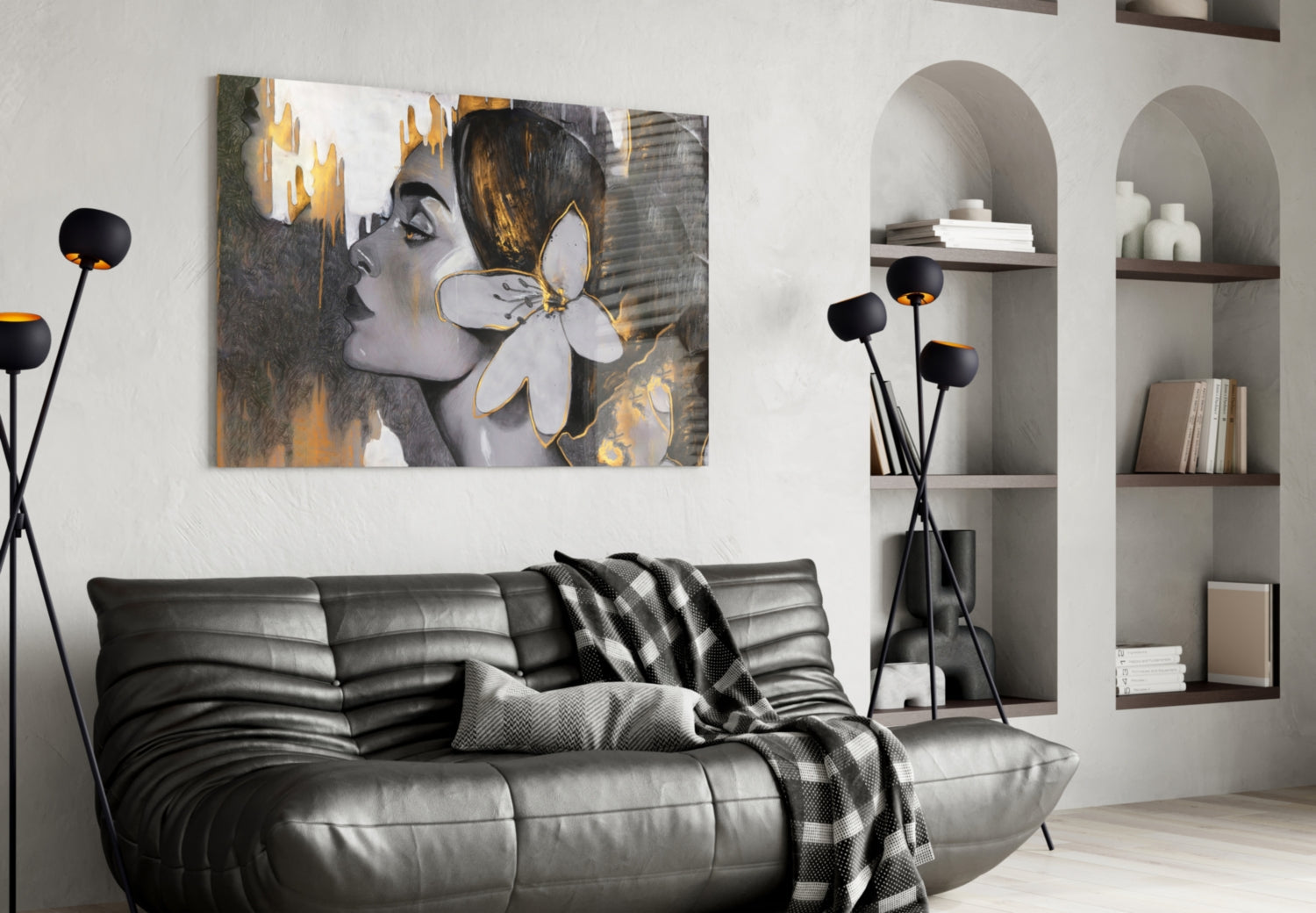 Modern living room with black leather sofa displaying Gipsy Beauty glass wall art featuring a woman's profile with white and gold flower above shelving.