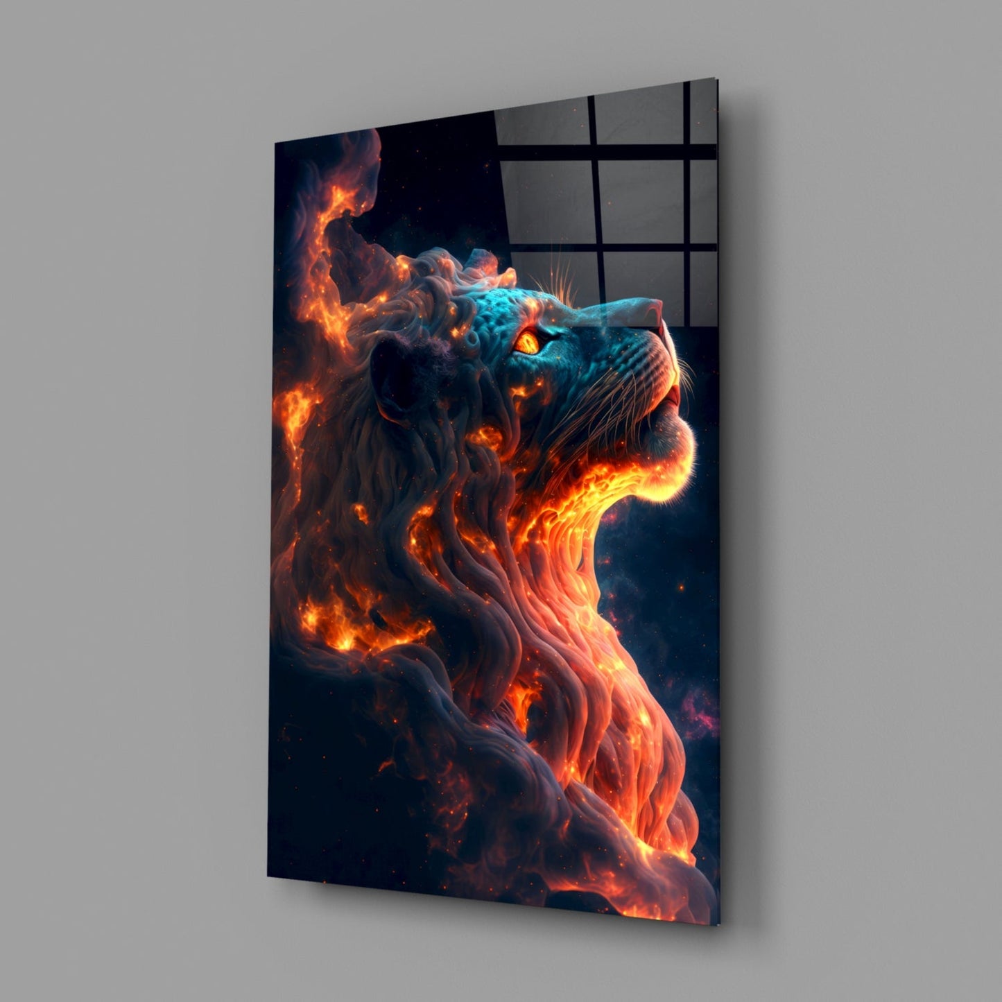 Angled view of glass wall art depicting a lion's head wreathed in orange flames and turquoise accents against dark background.