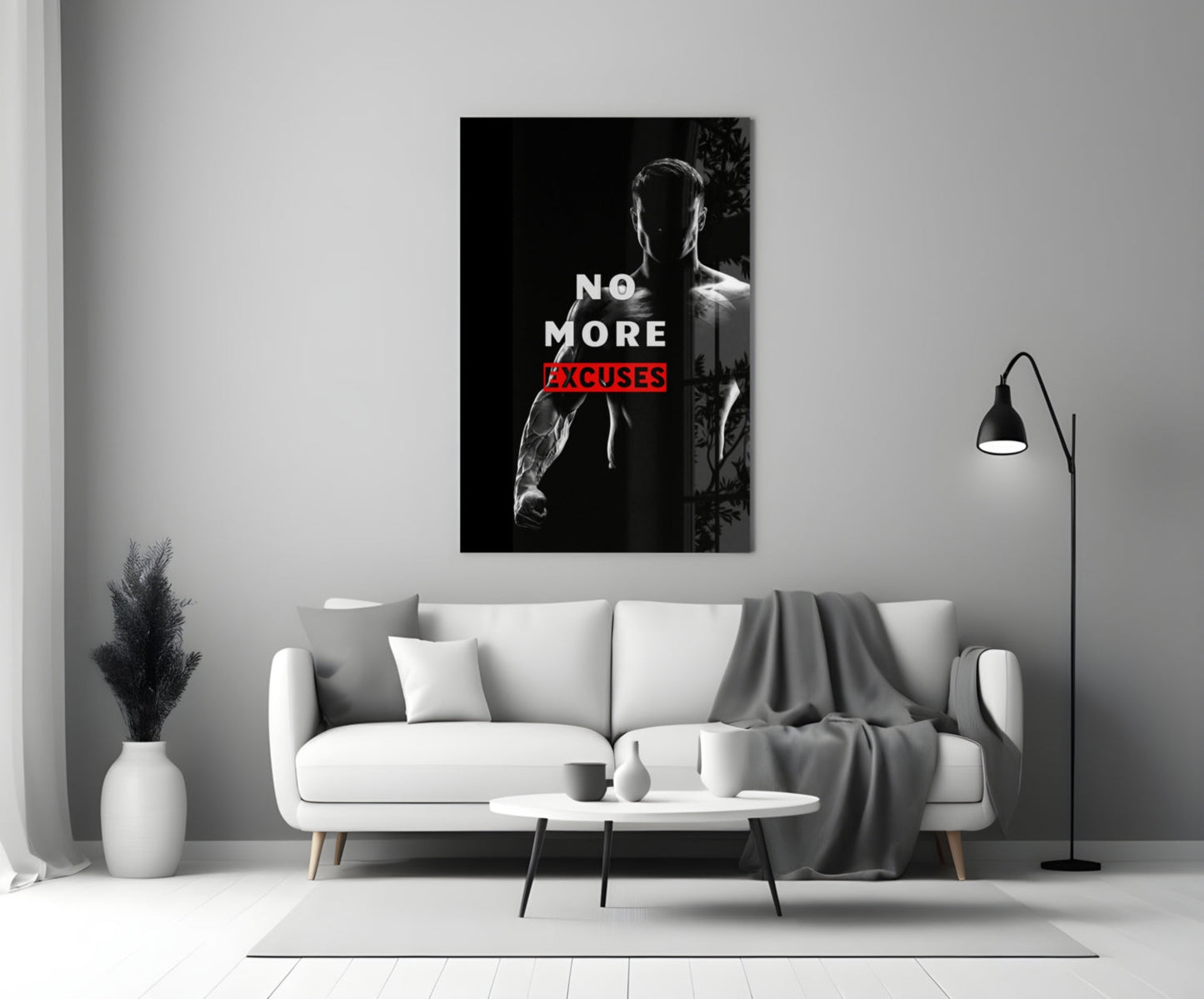 No More Excuses" glass wall art displayed above white sofa in minimalist living room setting with black floor lamp and white vase.