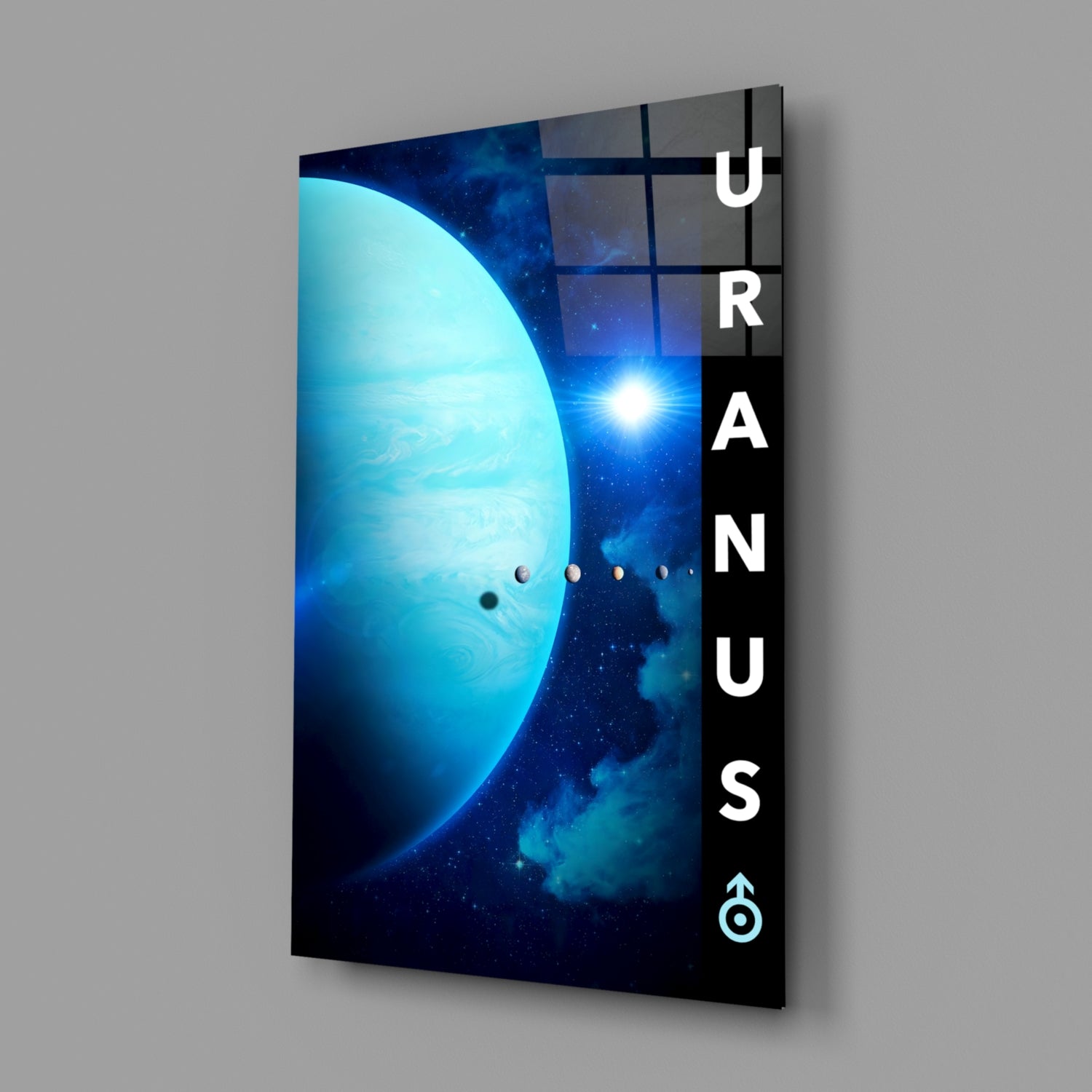 Angled view of glass wall art featuring a luminous blue planet, distant star, and orbital planets with "URANUS" text on black side panel.