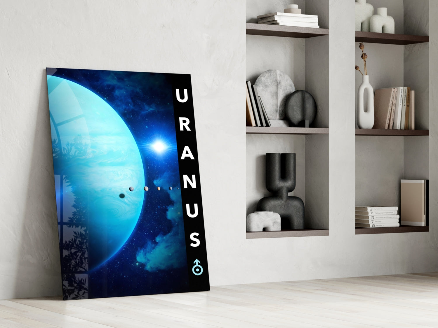 Glass wall art leaning against white wall displays blue planet with "Uranus" text, styled shelving with books and decorative objects visible behind.