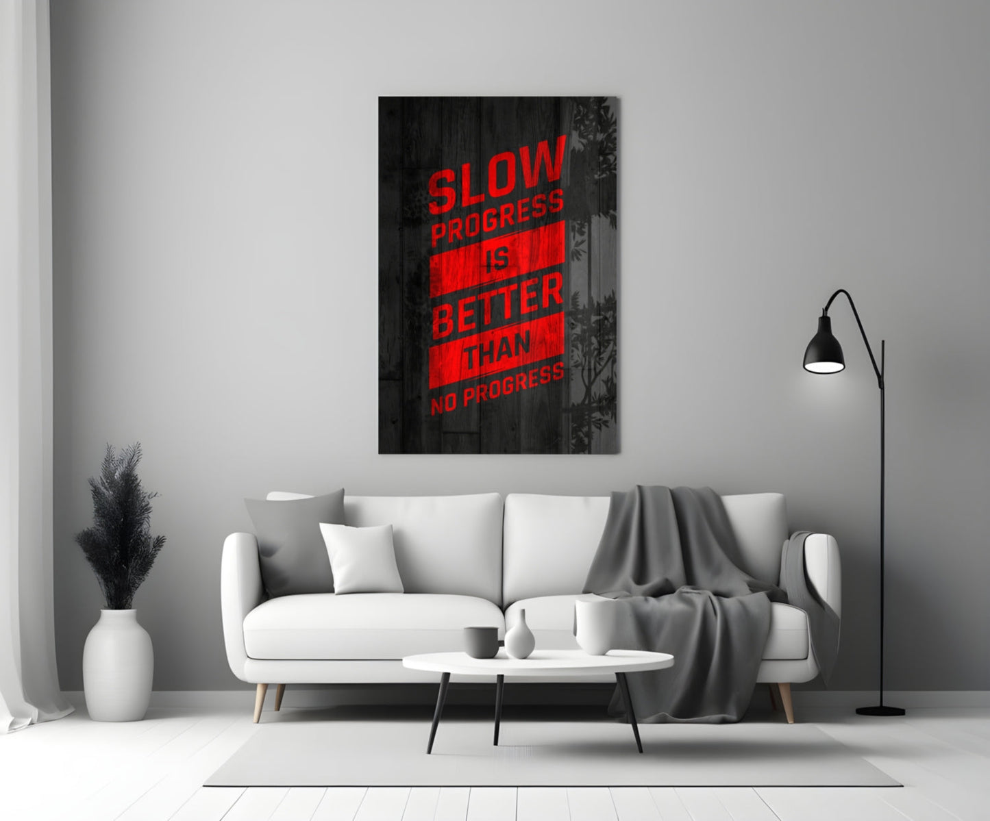 Red neon-style text reading "SLOW PROGRESS IS BETTER THAN NO PROGRESS" displayed on black wood-textured glass art hanging above a white sofa in a modern living room.