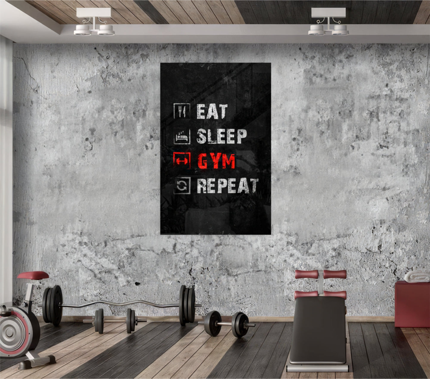 Black glass wall art displaying "Eat Sleep Gym Repeat" in white and red neon-style text, mounted in an industrial gym setting with concrete walls and exercise equipment.
