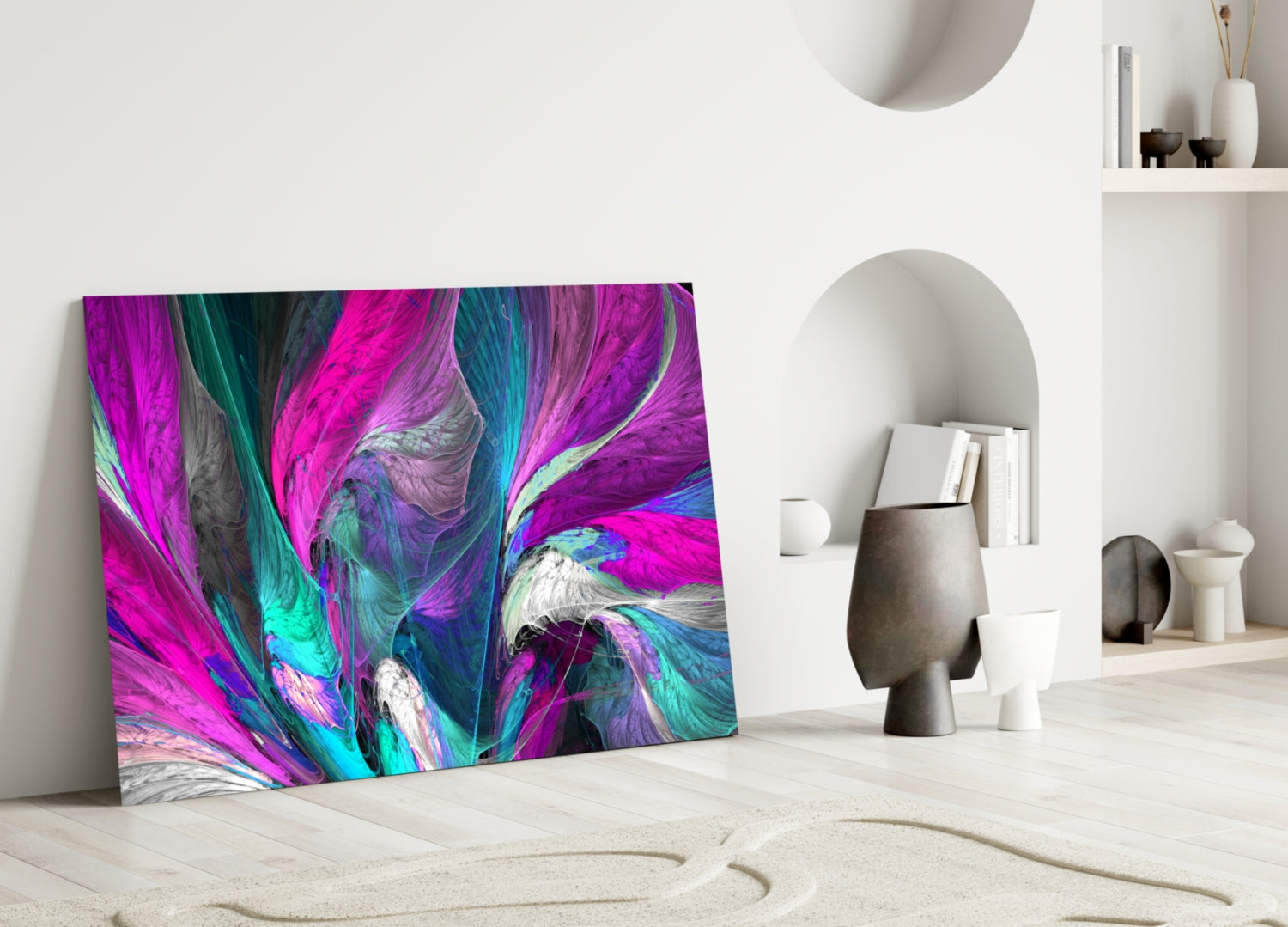 Vibrant abstract glass wall art with magenta, cyan, and purple swirling patterns leaning against white interior wall.