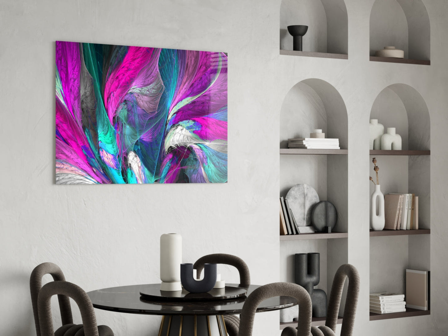 Vibrant magenta, cyan, and purple abstract glass artwork displayed above a black round dining table with upholstered chairs.