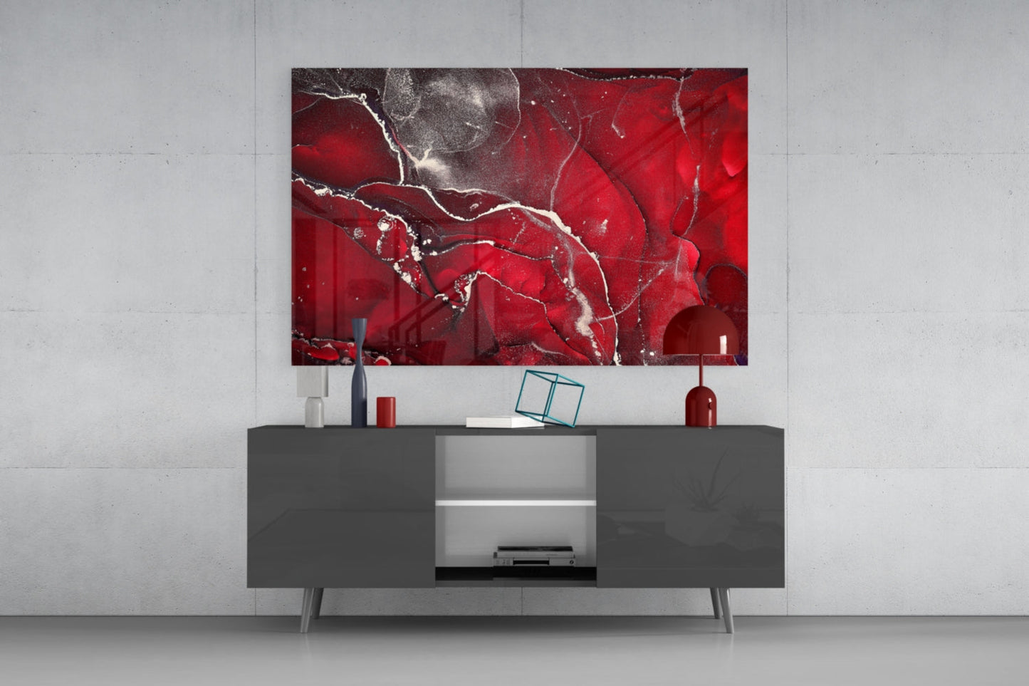 Red Marbellous Glass Wall Art displaying abstract red and white marble veining mounted above gray media console in modern interior setting.