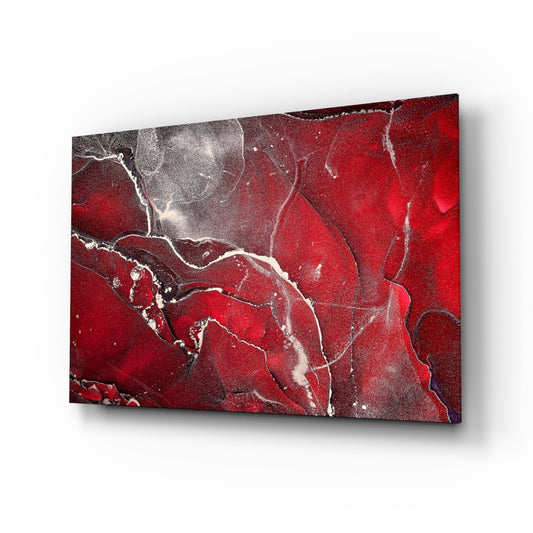 Red marbellous glass wall art panel displayed at an angle, showing deep red and grey swirled marble texture with white veining throughout.