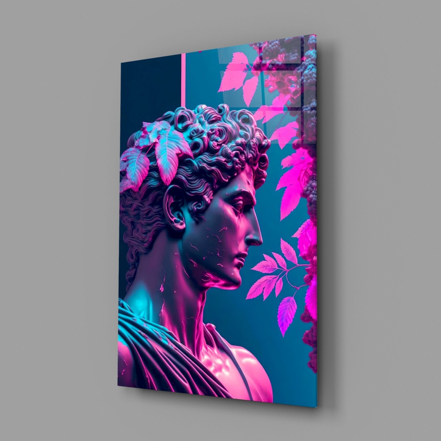 Angled view of glass wall art displaying a classical bust with neon pink and cyan lighting against teal background with magenta foliage.