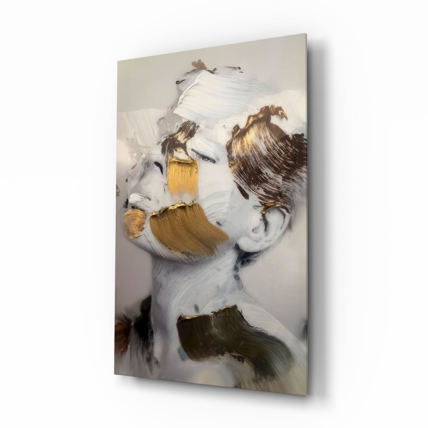 Abstract portrait of a face with white, gold, and brown brushstrokes on glass wall art, angled view.