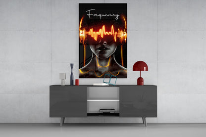 Modern interior display featuring Frequency glass wall art with neon orange soundwave and gold headphones on dark dresser.