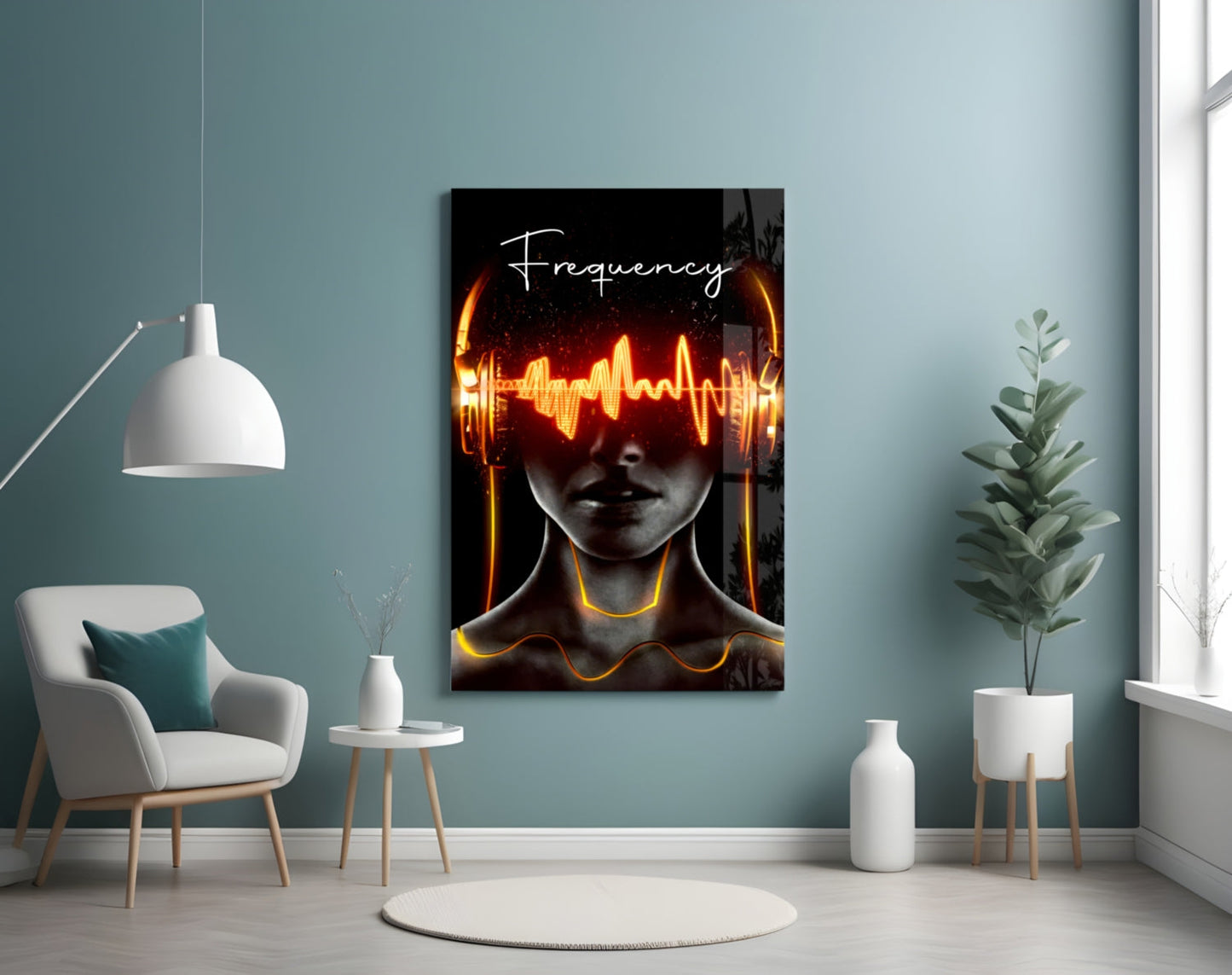 Modern living room with mist-blue walls displaying Frequency glass art featuring glowing orange sound waves and "Frequency" text above a figure's face.