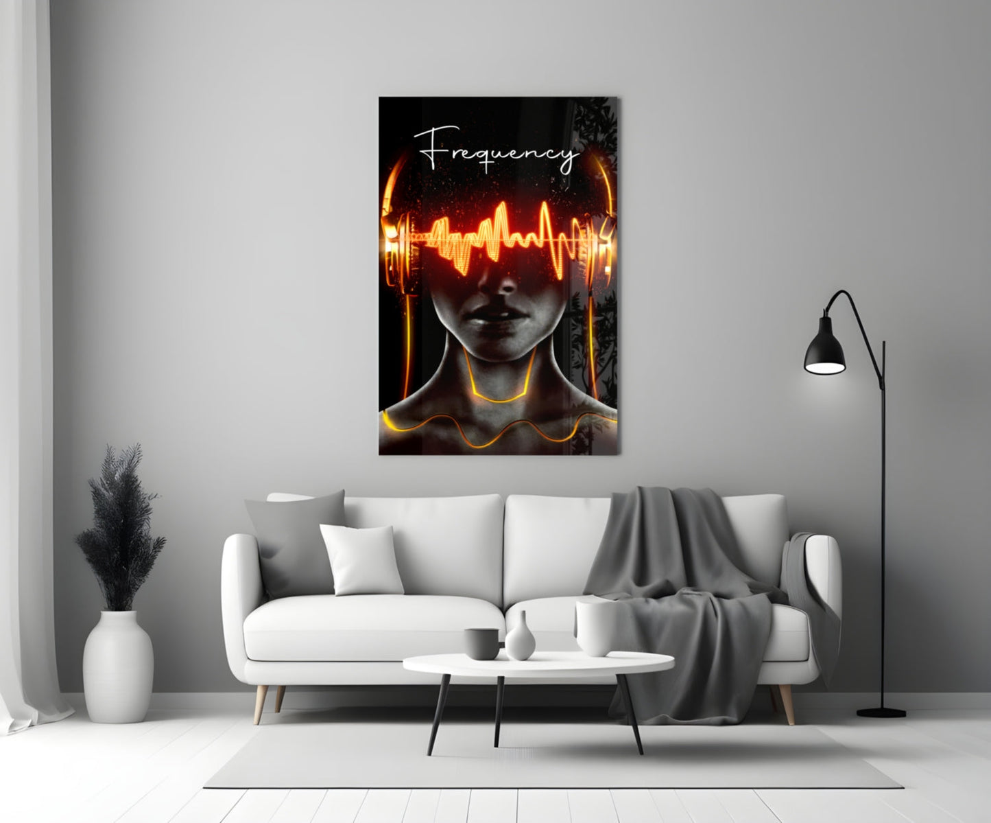 Modern living room with white sofa displaying neon glowing "Frequency" glass wall art above it.