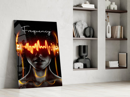 Modern interior displaying neon Frequency glass wall art leaning against white wall beside built-in shelving with decorative objects.