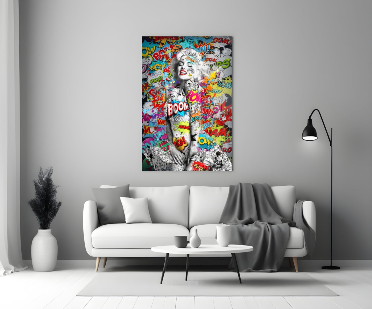 Pop art graffiti glass wall art featuring black and white portrait with colorful comic book text and speech bubbles displayed above white sofa.