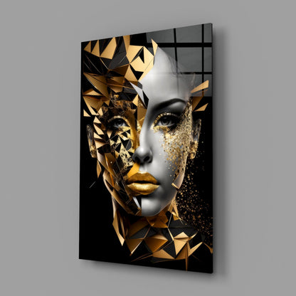 Modern glass wall art depicting a stylized face with white and gold geometric facets against black background, angled perspective.