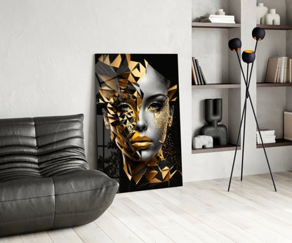Golden Face Glass Wall Art displayed in modern living room with gray sofa, shelving, and floor lamp.