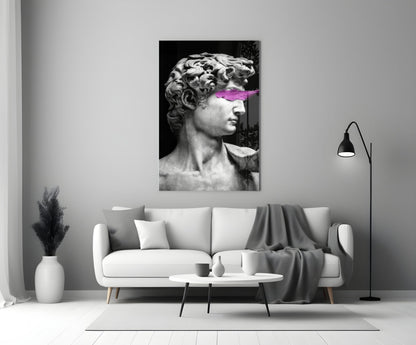 Classical marble bust with neon pink paint stroke across eyes, displayed above white sofa in minimalist interior.