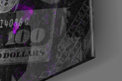 Close-up angled view of frosted glass wall art with dollar bill imagery and purple neon-style lighting effects.