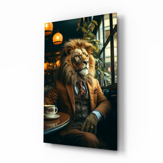 A lion wearing a brown blazer and tie sits at a café table with a teacup, illuminated by warm overhead pendant lights and green foliage.
