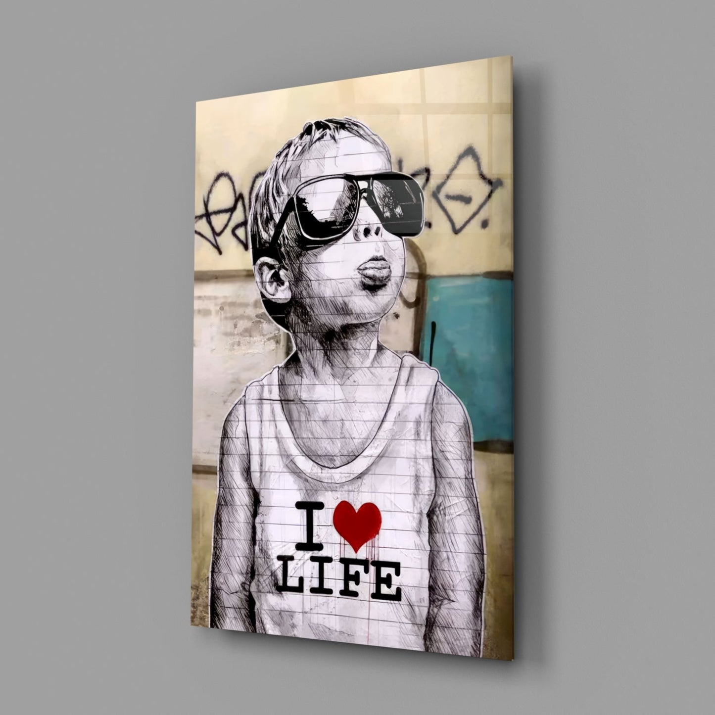 Glass wall art displaying sketch-style child wearing oversized sunglasses and "I ♥ LIFE" tank top against urban graffiti background.