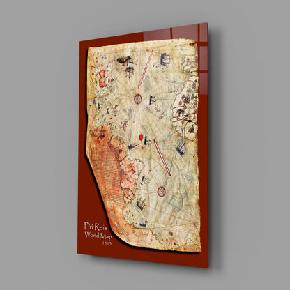 Angled view of Piri Reis World Map glass wall art on rust-red backing, showing aged parchment with navigation lines and colorful regional illustrations.